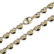 Close-up of 10k yellow gold hollow puff heart Gucci link chain showing lobster clasp and link details.