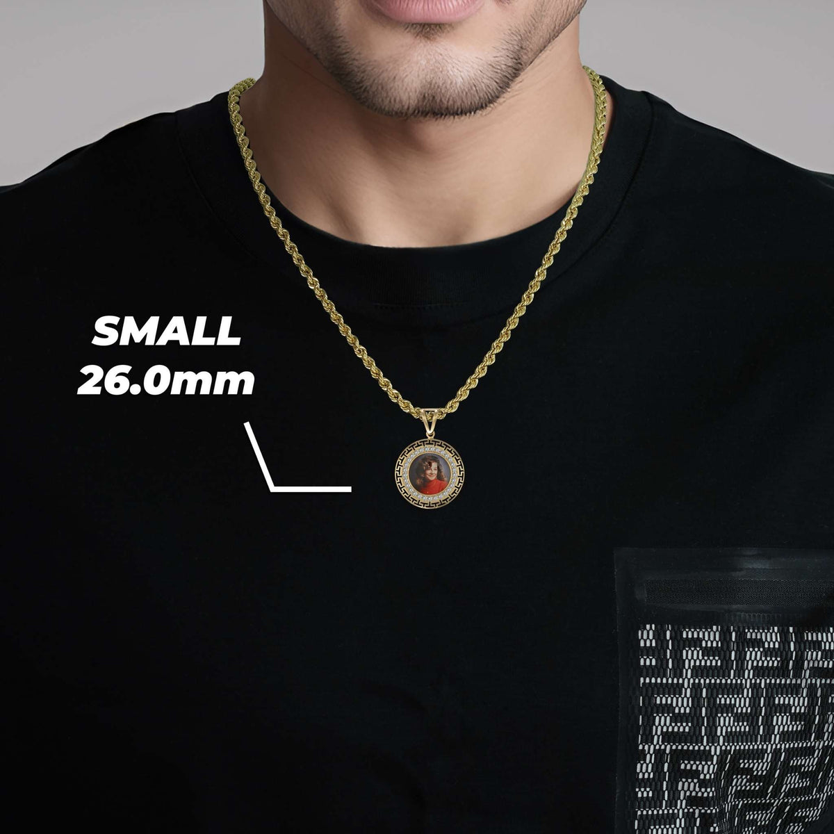 Man wearing a gold chain necklace with a small 26.0mm round memorial pendant featuring a custom photo.
