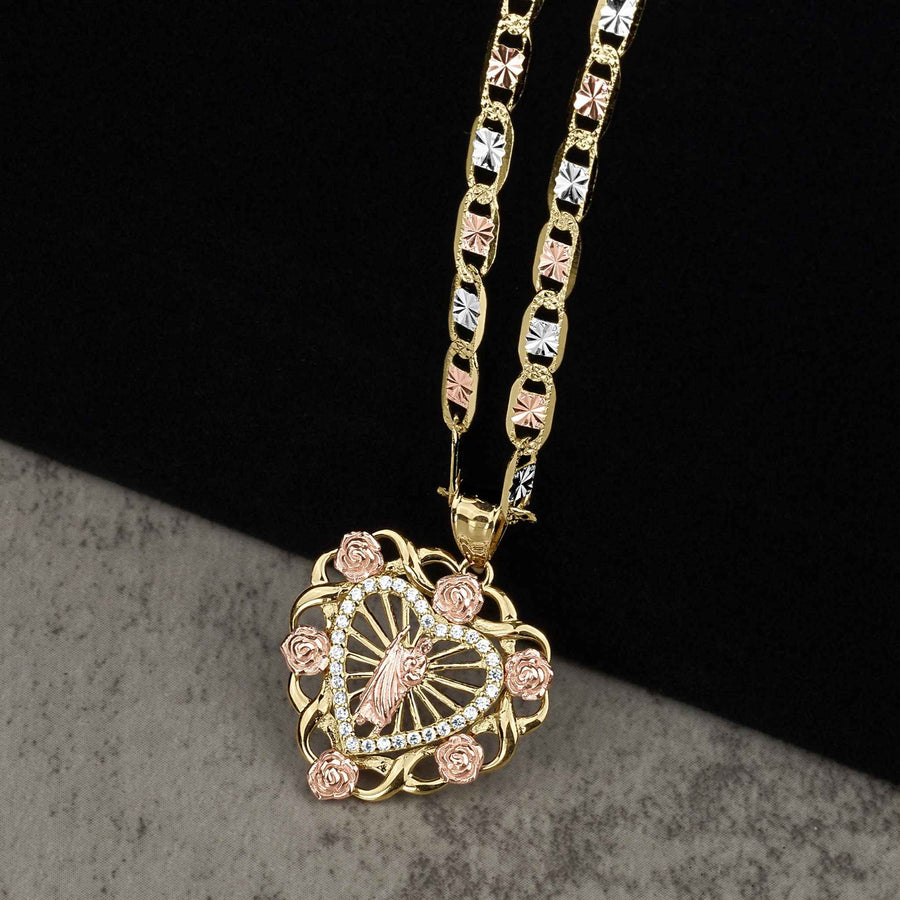 Two-tone rose and yellow gold heart pendant featuring a San Judas design and cubic zirconia.