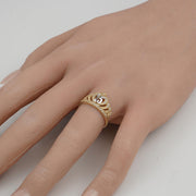 Two-tone gold quinceañera crown ring with number 15 worn on a hand display.