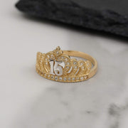 Two-tone gold crown quinceañera ring with number 15 and pavé cubic zirconia.
