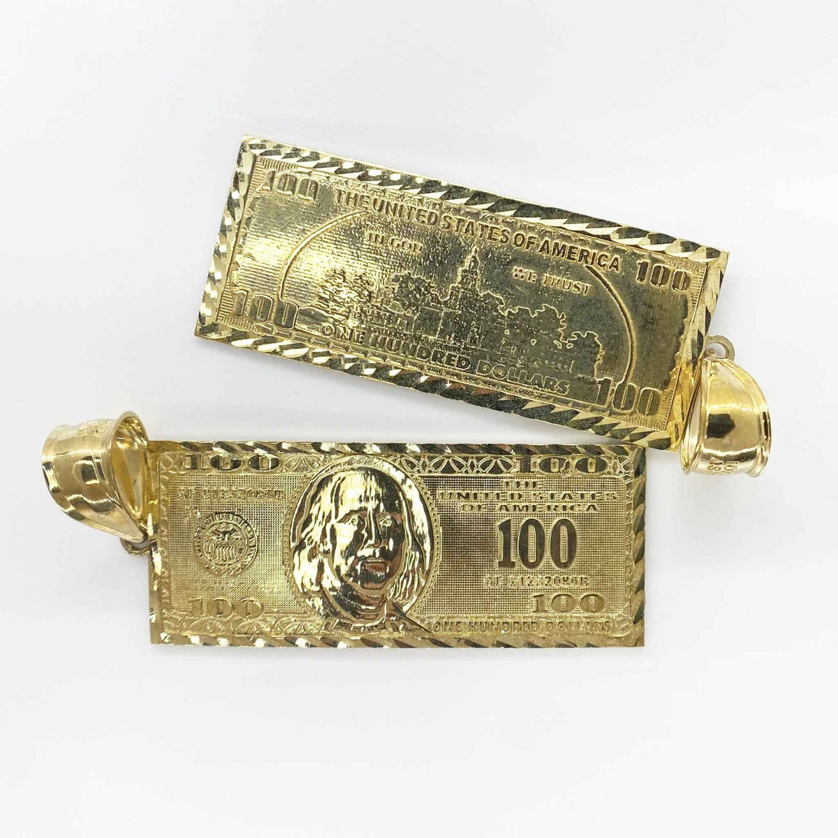 Front and back views of gold Benjamin hundred dollar bill pendant charms on white background.