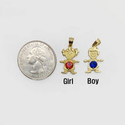 Size comparison of gold girl and boy birthstone pendants next to a US quarter.
