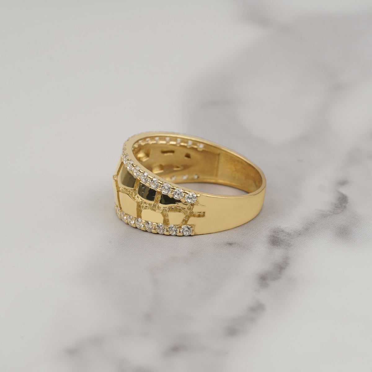 Side view of a gold nugget ring featuring sparkling CZ stones along edges.