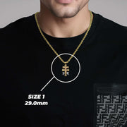 Model wearing a gold chain with the 29.0mm Caravaca crucifix pendant highlighted in white.