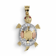 Isolated front view of a 10k or 14k tricolor gold turtle pendant charm without chain.