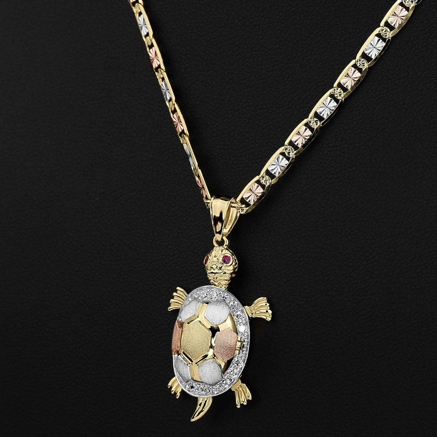 Front view of a tricolor 10k or 14k gold turtle pendant necklace with CZ accents.