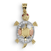 Tricolor gold turtle pendant featuring a detailed shell and sparkling cubic zirconia stones.