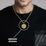 Man in black shirt showcasing a medium gold pendant necklace with size text.