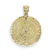 Round yellow gold pendant displaying an intricate Aztec calendar design and textured bail.