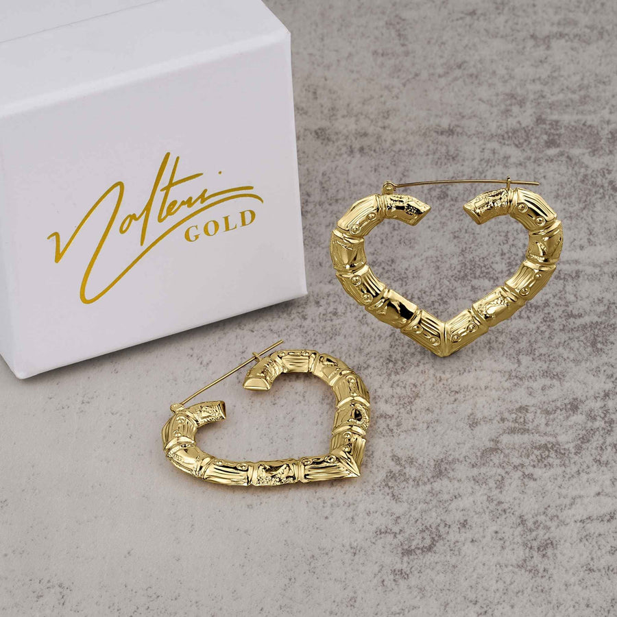 Pair of classic bamboo-style heart hoop earrings in yellow gold next to a Nolters box.