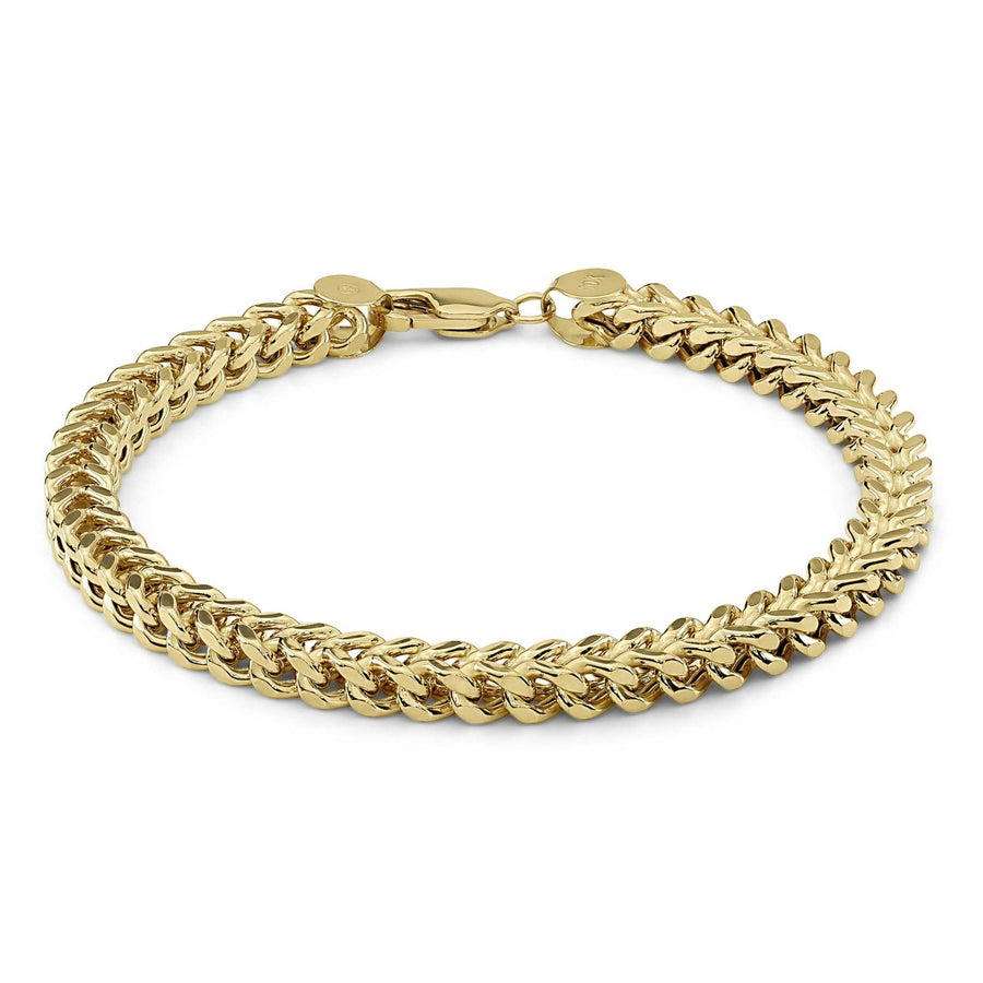 Yellow gold classic hollow Franco link bracelet formed in a circle on white background.