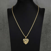 Gold heart nugget pendant necklace displayed on a black neck bust stand.