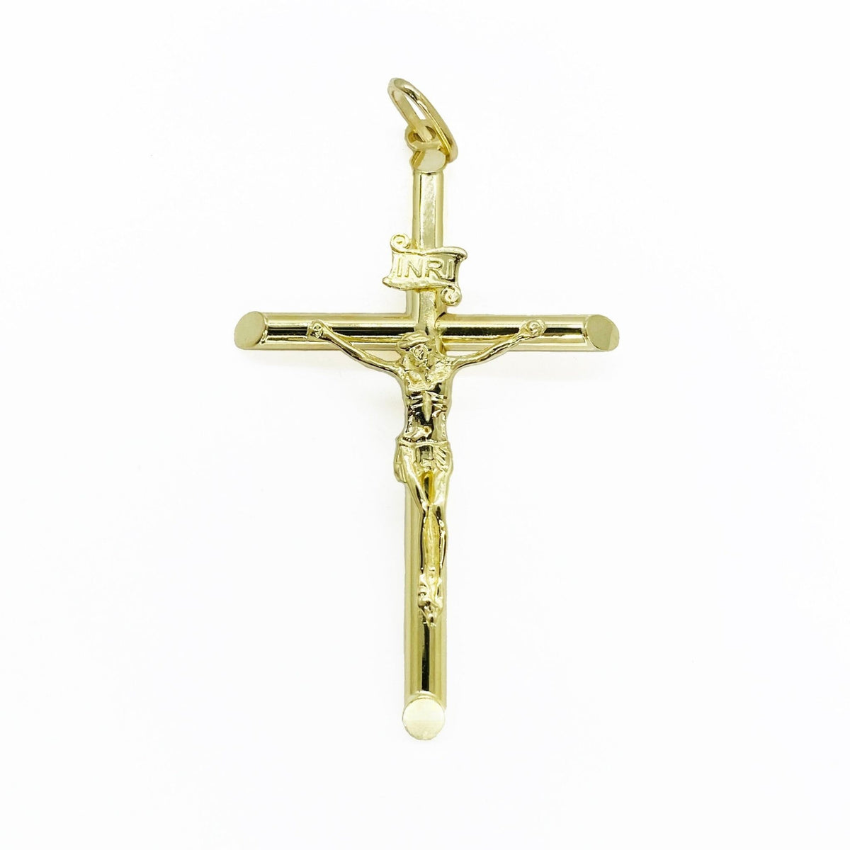 Front view of classic gold INRI Jesus crucifix cross charm centered on a white background.