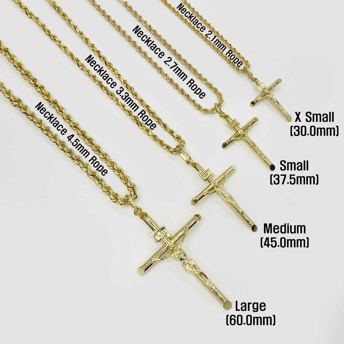 Four gold INRI crucifix pendant necklaces shown in sizes X Small to Large with rope chains.
