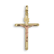 Two-tone yellow and rose gold INRI crucifix pendant on a white background.