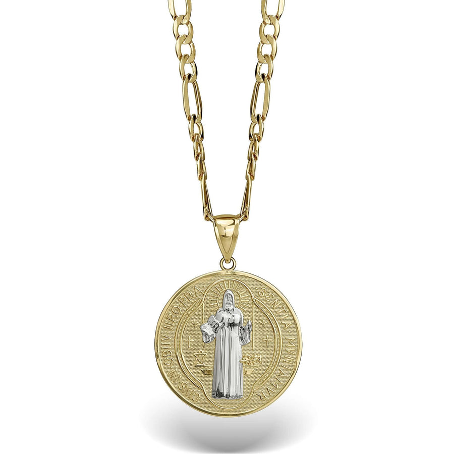Two-tone gold Saint Benedict medal pendant on a gold link chain against white.