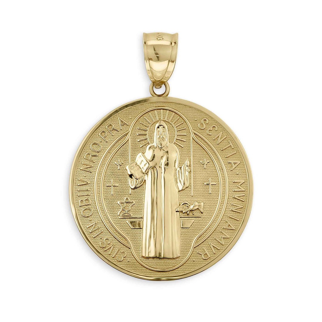 Close-up of a gold Saint Benedict medal pendant featuring intricate front engravings and bail.