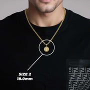 A man wearing a gold Saint Benedict pendant on a chain with text overlay reading SIZE 2 18.0mm.