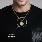 A man wearing a gold Saint Benedict pendant on a chain with text overlay reading SIZE 4 29.0mm.