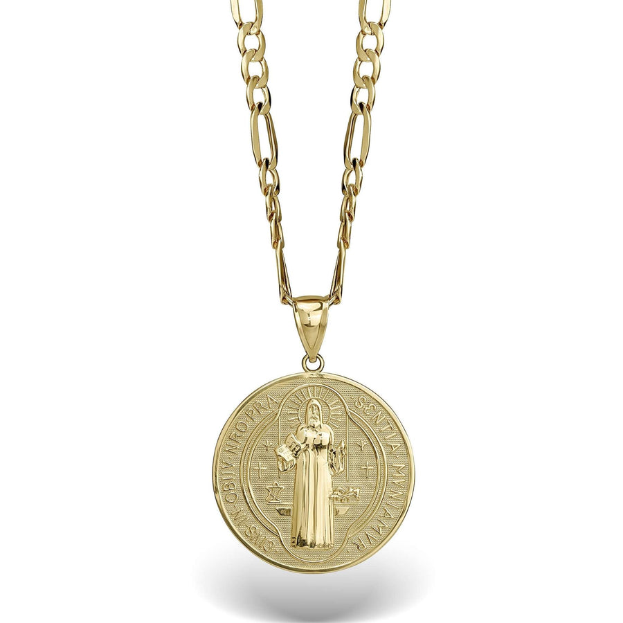 Close-up of a gold Saint Benedict medal pendant showing the detailed central figure and cross.