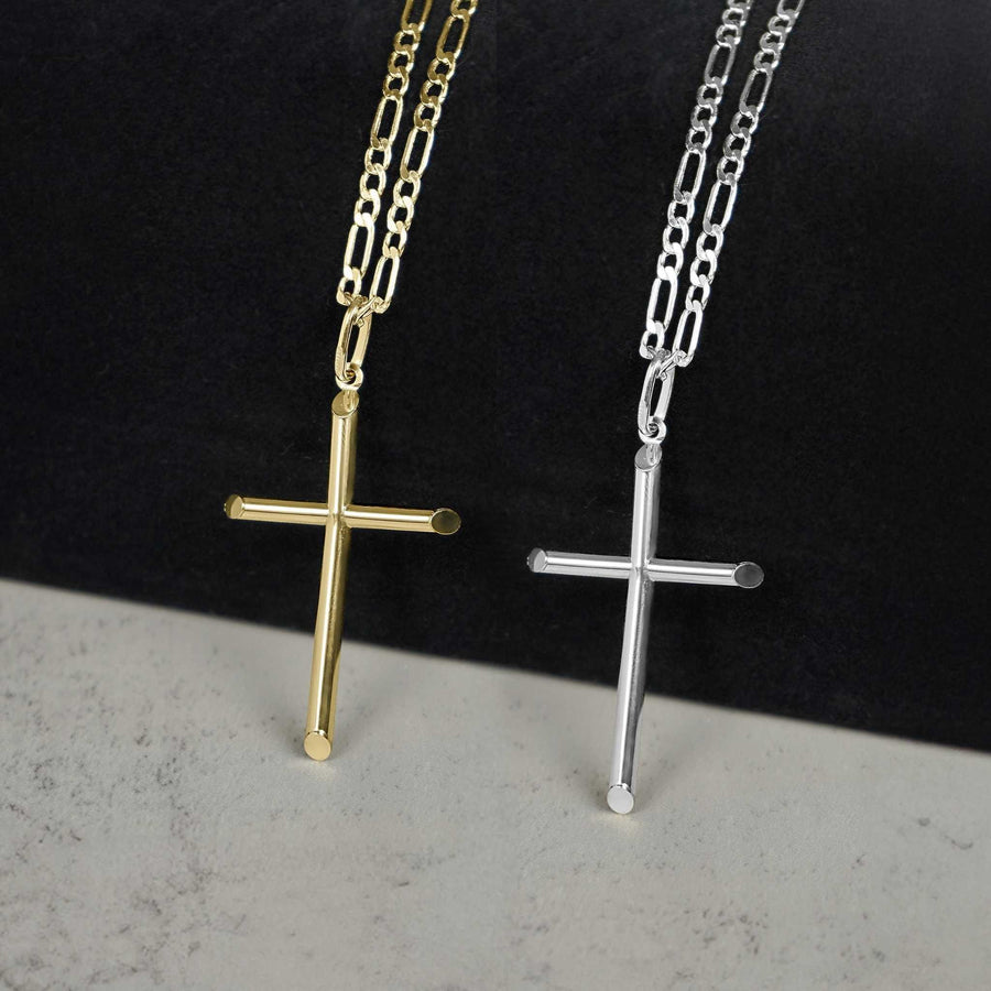 Yellow gold and white gold classic tube cross pendant necklaces on figaro chains displayed side-by-side.