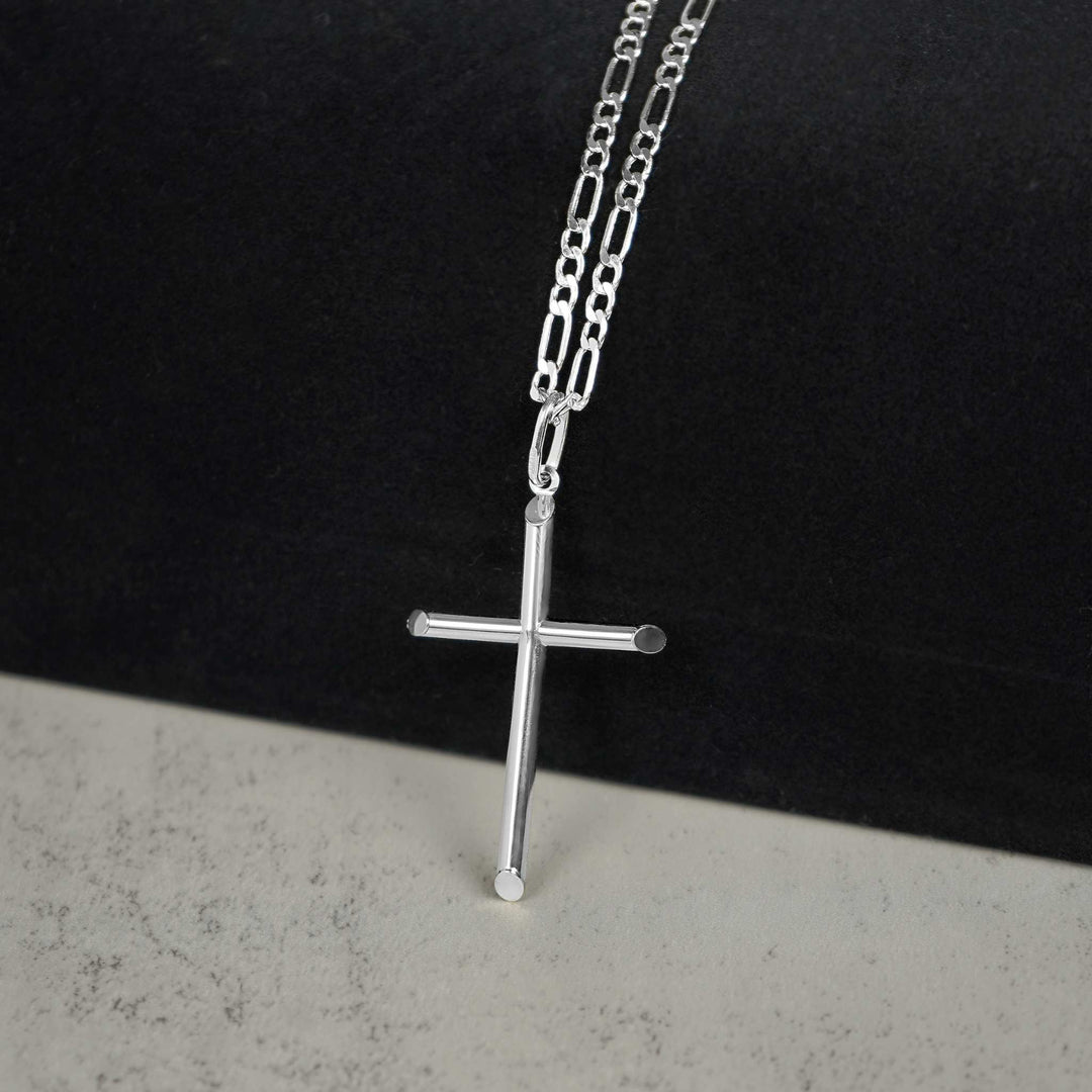 Polished white gold tube cross pendant necklace styled on a delicate paperclip chain.