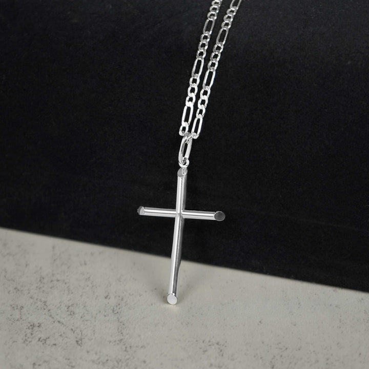 Polished white gold tube cross pendant necklace styled on a delicate paperclip chain.