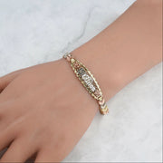 Elegant wrist shot of the 10k & 14k gold tricolor leaf link bracelet.