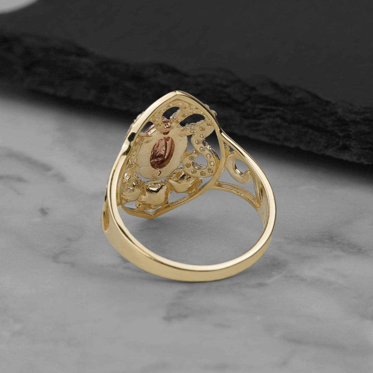 Rear view of the 10k and 14k gold Virgin Mary ring showing its inner band construction.