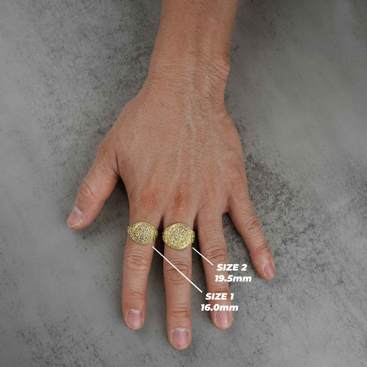 Hand wearing two 10k - 14k Classic Aztec Mayan Calendar Round rings with size labels.