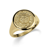 Front view of a round yellow gold signet ring featuring an intricate Aztec calendar.