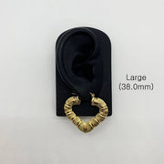 Large 38.0mm gold bamboo heart hoop earring displayed on a black ear model.