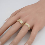 On-model size comparison displaying small and medium gold dual heart cubic zirconia rings