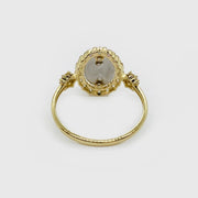 14k gold Virgen de Guadalupe oval ring with cubic zirconia, close-up detail