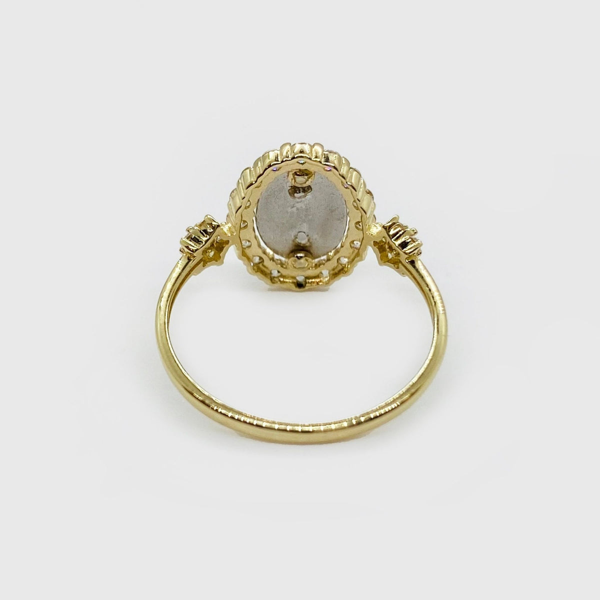 14k gold Virgen de Guadalupe oval ring with cubic zirconia, close-up detail