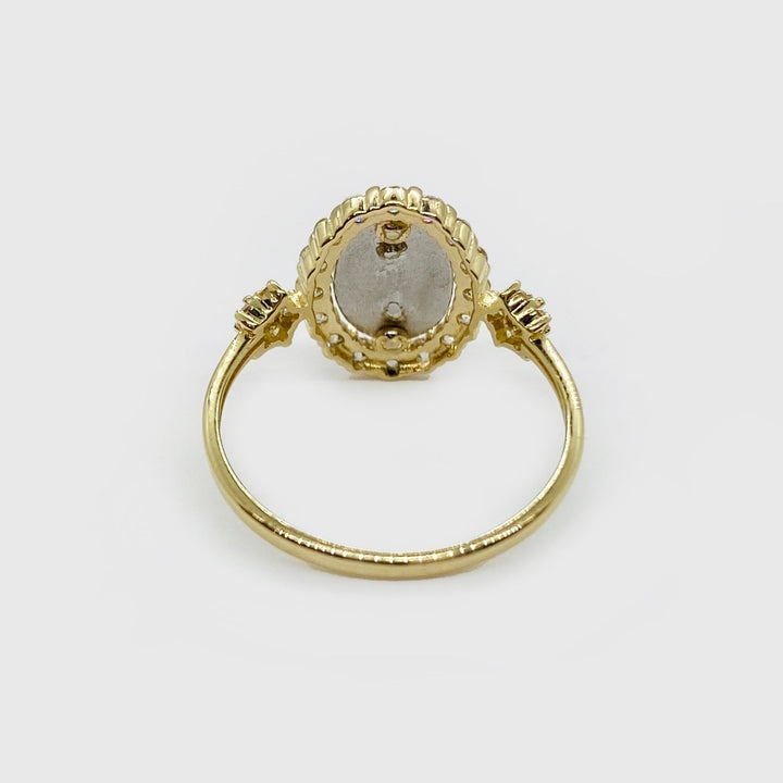 14k gold Virgen de Guadalupe oval ring with cubic zirconia, close-up detail