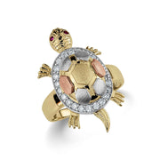 Detailed view of a tricolor gold turtle ring featuring glittering cubic zirconia gemstone accents.