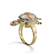 Side view of a tricolor gold Cari turtle ring with cubic zirconia on white background.