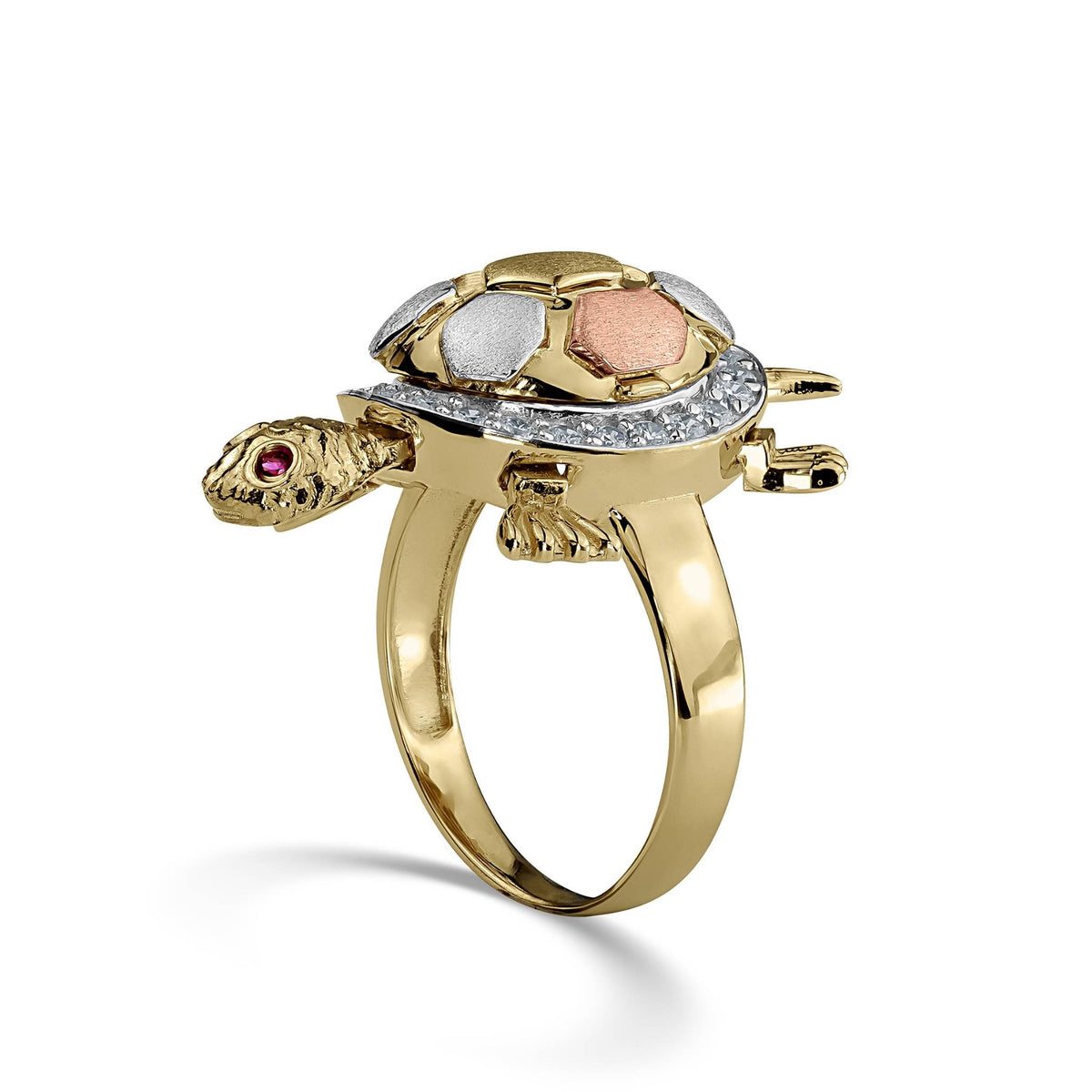 Side view of a tricolor gold Cari turtle ring with cubic zirconia on white background.