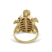 Bottom view of the tricolor gold turtle ring showing the inner band and smooth undercarriage.