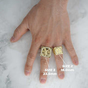 Two sizes of the gold Centenario square coin ring modeled on a hand.