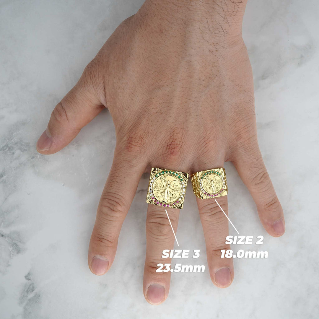 Lifestyle view of two gold Centenario rings with size labels on a hand.