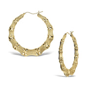 Pair of polished yellow gold bamboo-design round hoop earrings on a white background.