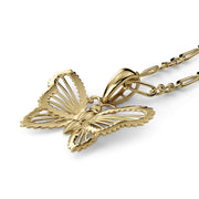 Polished gold butterfly pendant necklace with a matching link chain on a white background.