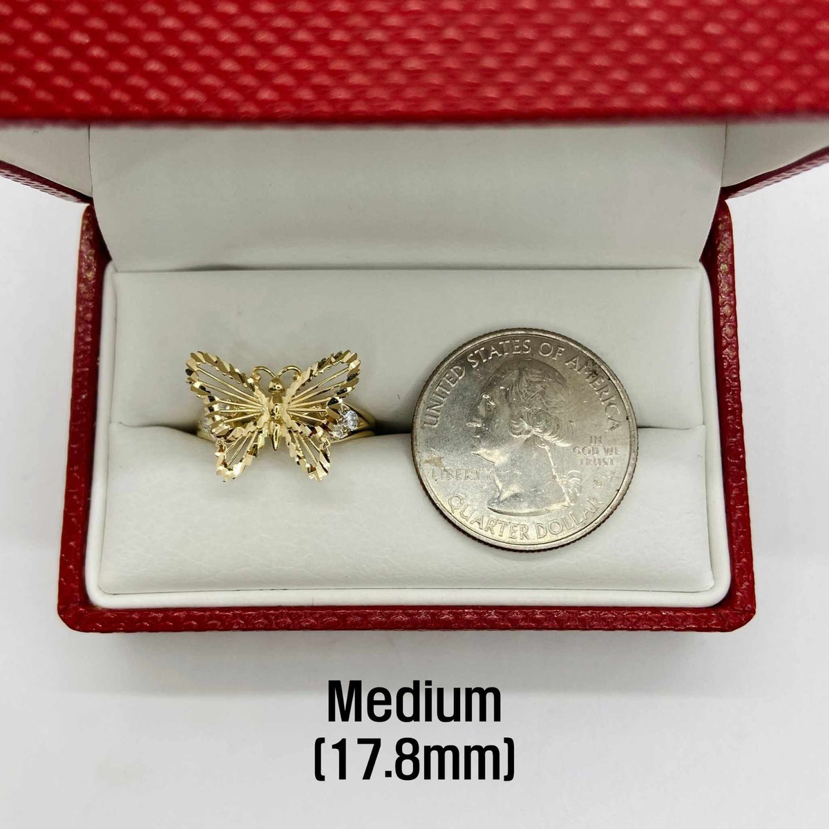 10k - 14k Gold butterfly ring in a red box with a quarter for comparison.