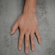 Hand wearing a solid 10k or 14k gold classic Rolo chain link ring.