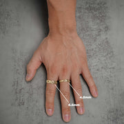 Hand wearing two gold Figaro band rings with size measurement labels for 4.5mm and 6.5mm.