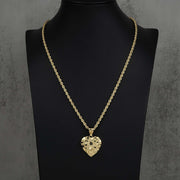 Textured 10k or 14k gold heart-shaped nugget pendant hanging from a classic rope chain.