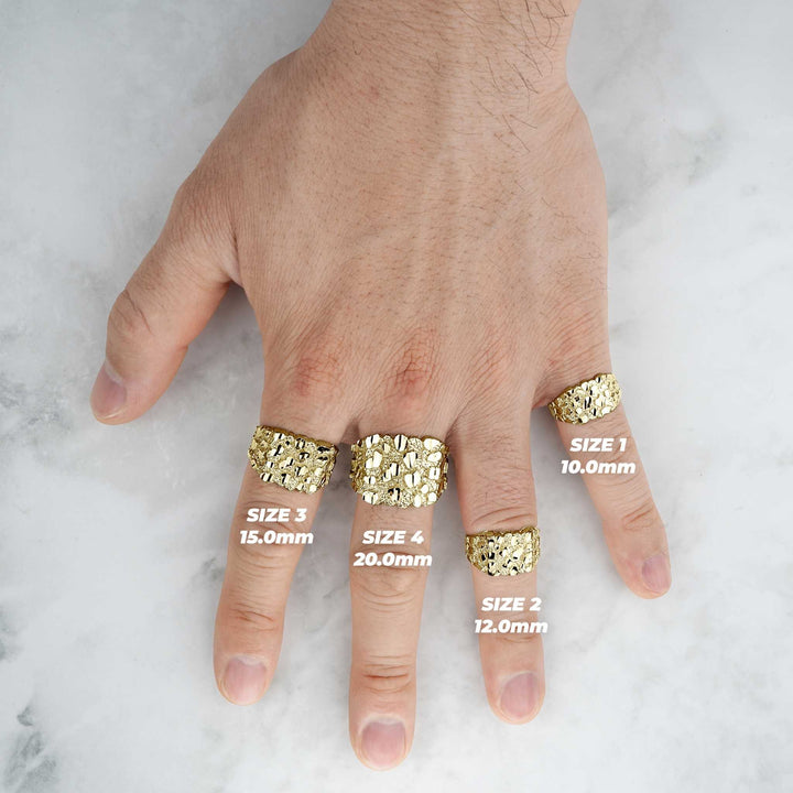 A complete hand layout displaying the width and fit of four textured gold nugget rings.